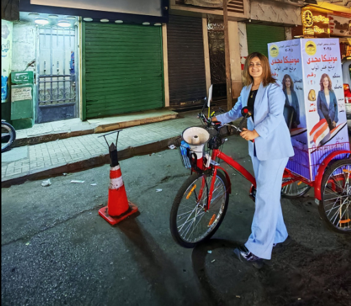 بعجلة وميكروفون مرشحة مجلس النواب في شبرا، فيتو