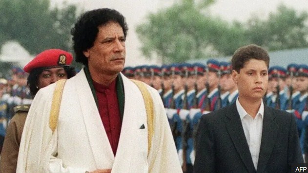 سيف الإسلام القذافي ووالده