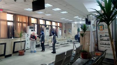 تطهير فرع البنك الأهلي بدمنهور بعد ظهور حالة إصابة بكورونا l صور
