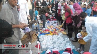 بائعو الأعلام ورسامو الوجوه ينتشرون بلجان شبرا الخيمة