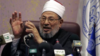 القرضاوى يزعم: المشاركة في الانتخابات 