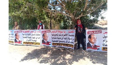 بالكمامات.. سكان حدائق الأهرام يحتجون على تدني الخدمات وانتشار البلطجية  | صور