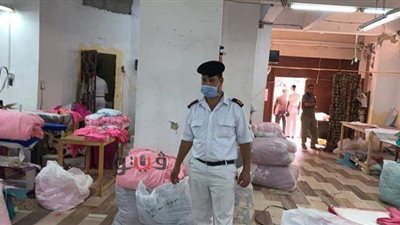 ضبط مصنع ملابس ينتج كمامات مغشوشة بعين شمس