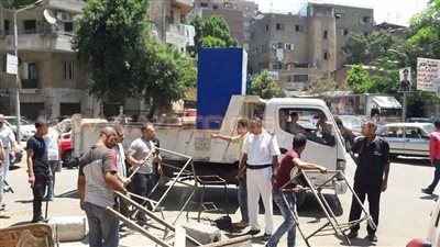 بالصور.. رفع إشغالات حي الدقي