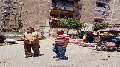 فض سوق الجمعة في  الخانكة للوقاية من فيروس كورونا  | صور