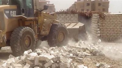 إزالة 9 حالات تعد على أراضي الدولة في قنا