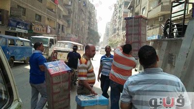 بالصور.. حملة لرفع إشغالات الطريق بشارع العشرين في فيصل