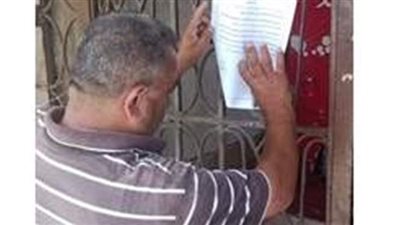 لصق إنذارات على عقارات الإسكندرية لسرعة التقدم بطلب طلاء الواجهات