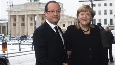 ألمانيا وفرنسا تتعهدان بإيجاد حل لأزمة الديون الأوربية