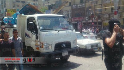 بالفيديو والصور.. القوات الخاصة تشارك فى حملة لإزالة إشغالات الباعة الجائلين بالدقي