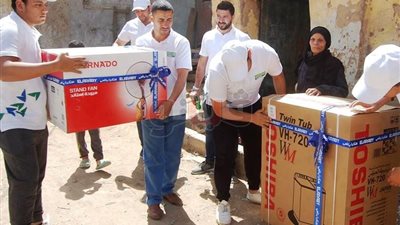 توزيع أجهزة منزلية على الأمهات المثاليات في سوهاج (صور)