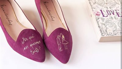 مصممة تخصص الرسم على الأحذية (صور)