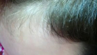 صبي يفاجئ والدته بسبب إطالة شعره 5 أعوام (صور)