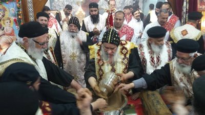 26 صورة تجسد تطييب رفات الشهيدة دميانة في قنا