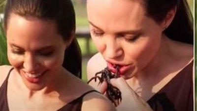 شاهد.. أنجيلينا جولي وأطفالها يأكلون العناكب في كمبوديا