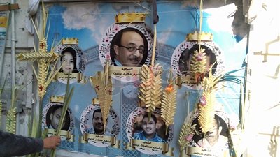 صور شهداء المرقسية تزين الكنيسة تزامنا مع عيد السعف بالإسكندرية