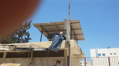 20 صورة ترصد دهان مباني مستشفى بورفؤاد استعدادا لتطبيق منظومة التأمين الصحي