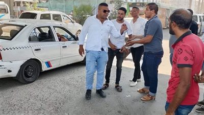 ضبط 11 سيارة غير ملتزمة بخط السير وتعريفة الركوب بالجيزة..صور