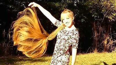 بالصور.. رابونزول الحقيقية تكشف أسرار طول شعرها