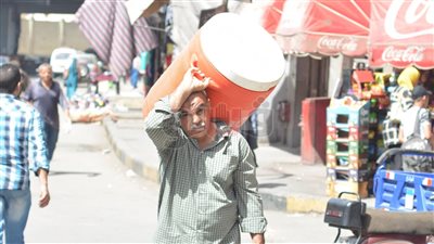 18 صورة ترصد موجة الحر في الشوارع