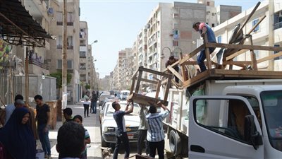 بالصور.. رفع 60 حالة إشغالات في حملة مرافق بالعجمي