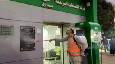 تطهير مدارس ومواقف سرافيس ومكتب بريد بالجيزة ضد كورونا | صور