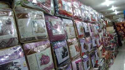 ضبط مفروشات وملابس مصرية تباع كمستوردة ببورسعيد