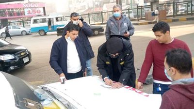 تغريم 10 مواطنين غير ملتزمين بالكمامة في الجيزة | صور