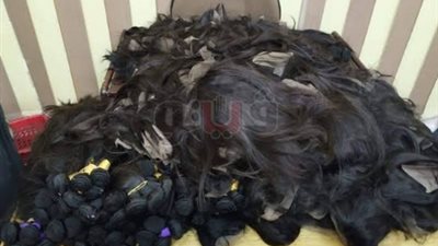 ضبط راكبة حاولت تهريب 13 كيلو شعرا مستعارا وكاميرات تصوير بمطار القاهرة