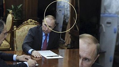 بالصور.. «الكرملين» يكشف سر جهاز ظهر خلف بوتين في أحد اجتماعاته