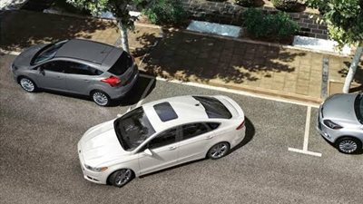 مرور الجيزة يرفع سيارات انتظار عمودي في شارع البحر الأعظم