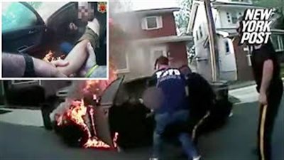 لحظة إنقاذ رجل احتجز داخل سيارته المشتعلة (فيديو)