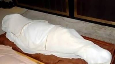 تحريات مكثفة لفك لغز العثور على جثة مسن مقيد الأيدي داخل شقته بالعجوزة