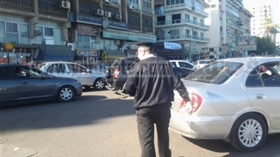 انتظام الحركة المرورية فى شارعى فيصل والهرم بالجيزة