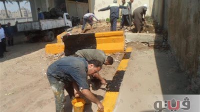 بالصور.. أعمال صيانة ودهانات بمبنى جراج بولاق الدكرور