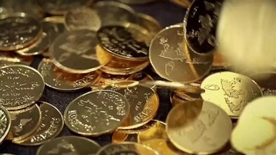 بالصور.. «داعش» يستبدل العملة الورقية بالدينار الذهبي والدرهم الفضي