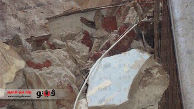 بالصور.. انهيار جزئى لعقار فى بورسعيد بسبب الطقس السيئ