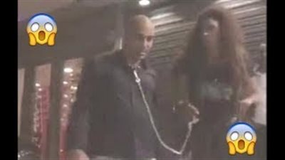 بالفيديو.. فتاة تجر شابا بسلسلة ونشطاء «فيس بوك»: شاذ جنسيا