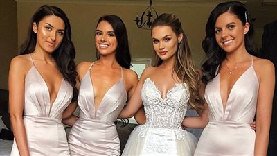 عروس ترتدي خمسة فساتين بسبب حيرتها (صور)