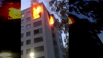 رجل يشعل النيران في شقته ويقفز من شرفتها (فيديو)