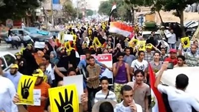 ملثمون يقودون مسيرة لـ 