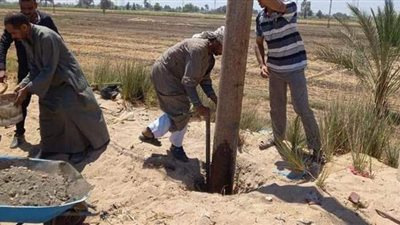 تدعيمات أسمنتية لأعمدة إنارة طريق 620 بسمالوط بالمنيا | صور