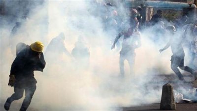 سائقو سيارات يرفعون شعارات معادية لواشنطن ويطلقون النارعلى المتظاهرين ببغداد