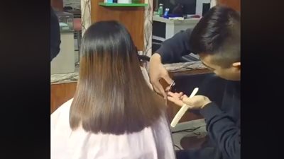 رد فعل مصفف شعر قص قميص زبونته بدلا من شعرها (فيديو)