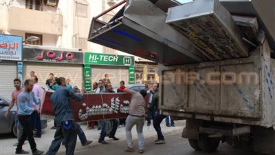 بالصور.. الجيزة: حملة مكثفة لإعادة انضباط الشارع وغلق 22 محل غير مرخص