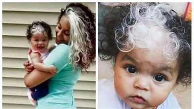بالصورة.. طفلة رضيعة تورث خصلة شعر والدتها البيضاء