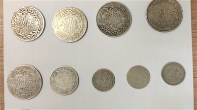 ضبط محاولة تهريب 34 عملة أثرية لعصور مختلفة بمطار القاهرة| صور