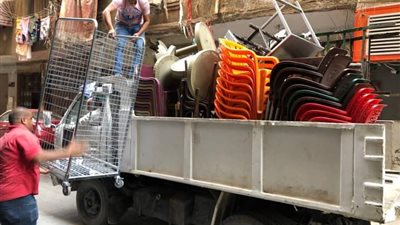 غلق وتشميع محلات تجارية ورفع ٣٧٣ حالة إشغال وتجريد ورفع مخلفات بحي العجوزة| صور 