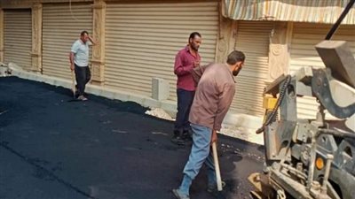 إزالة تعديات ورفع حواجز حديدية وتركيب أعمدة إنارة بشمال الجيزة | صور