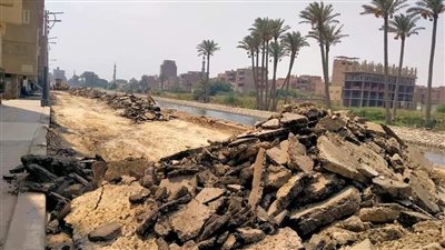 إزالة طبقه الطريق المتهالك بشارع عمرو بن العاص بالبدرشين| صور